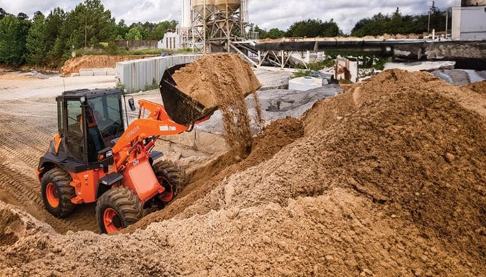 Hitachi Truck on construction sight picking up sand